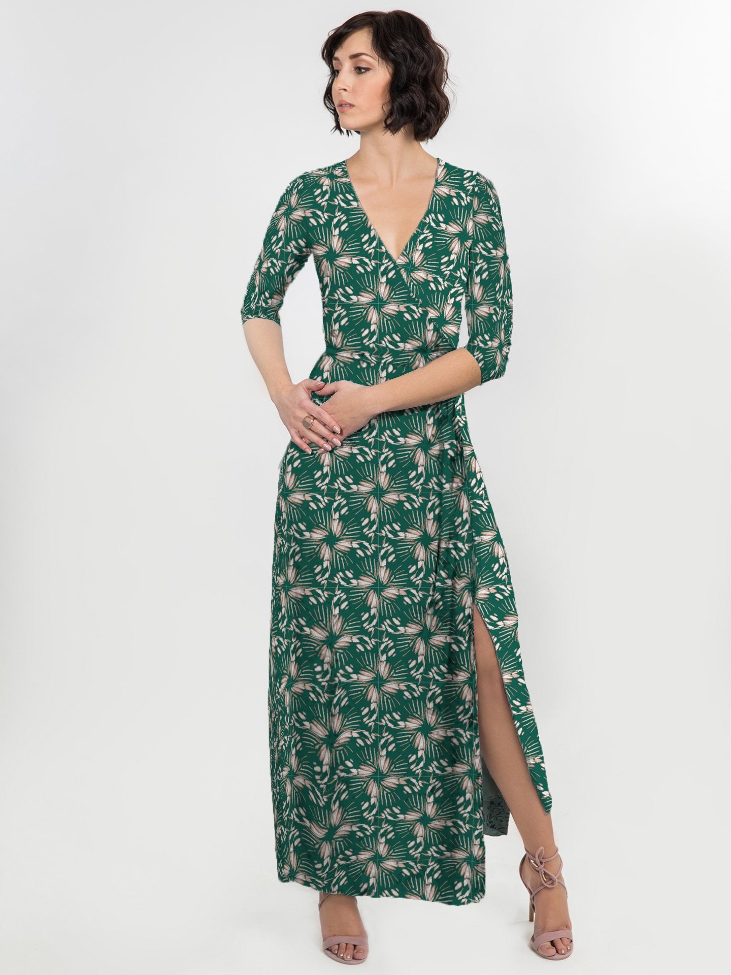 Salmon Bella Natalie dress in vibrant green, flowing fabric with a stylish neckline, displayed on a hanger against a white background.