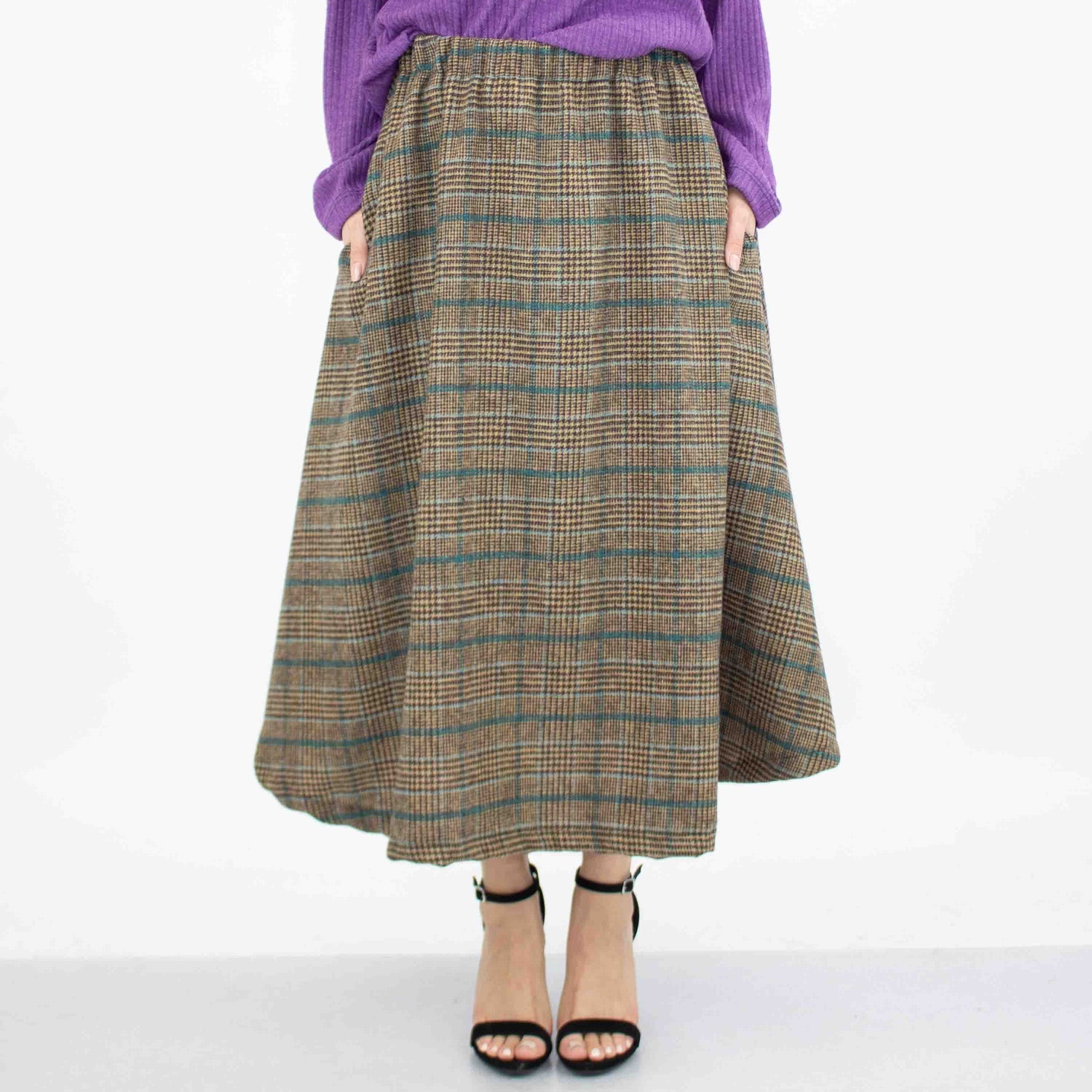 Blue plaid flare midi skirt with side pockets by Yellow Hera, featuring a stylish and comfortable design.