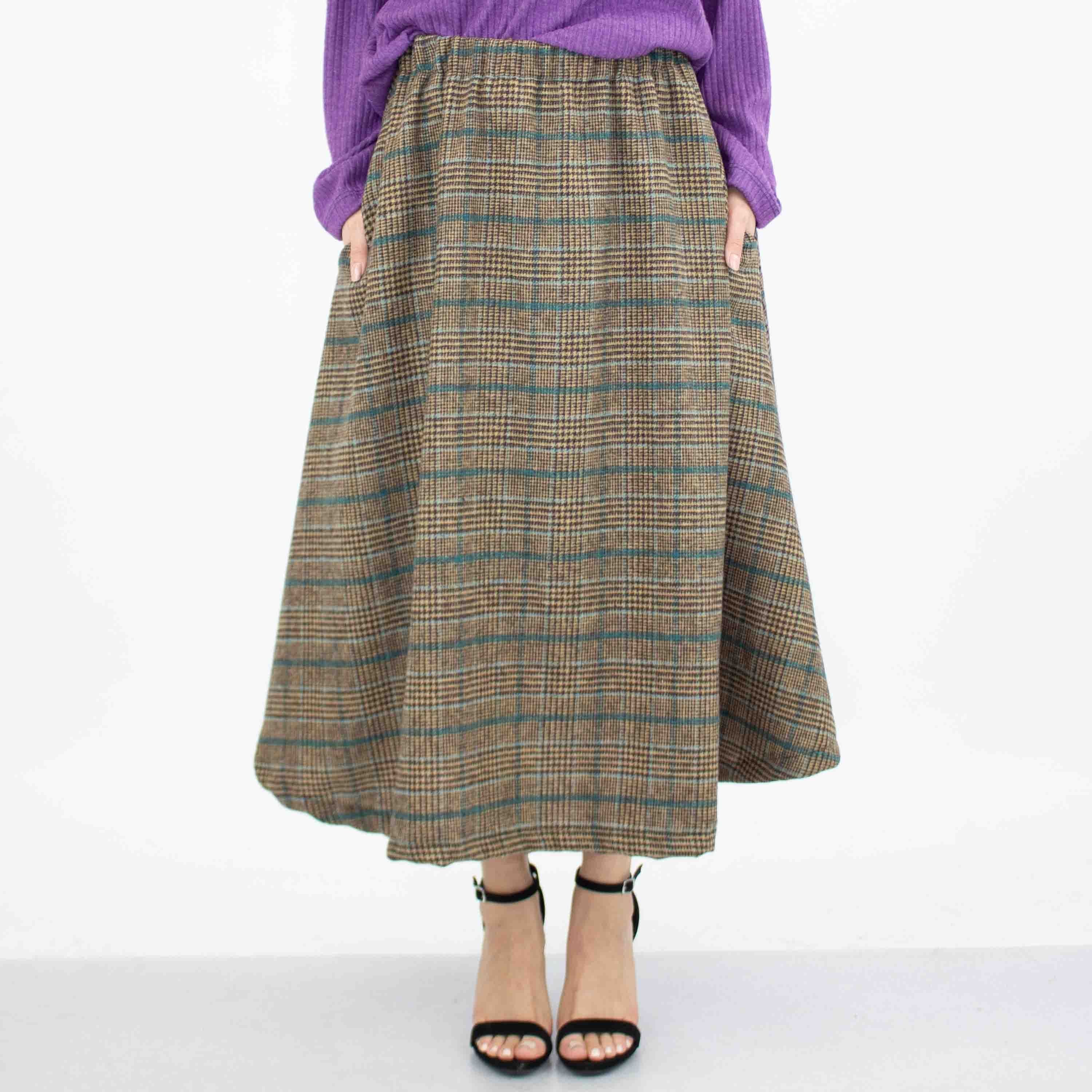 Blue plaid flare midi skirt with side pockets by Yellow Hera, featuring a stylish and comfortable design.