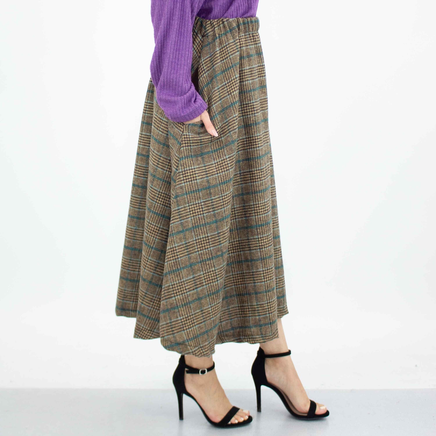Blue plaid flare midi skirt with side pockets by Yellow Hera, featuring a stylish and comfortable design.