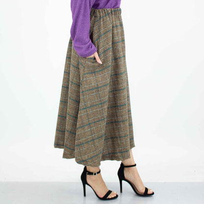 Blue plaid flare midi skirt with side pockets by Yellow Hera, featuring a stylish and comfortable design.