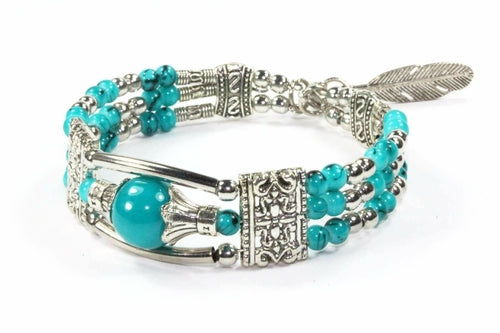 Silver Hestia feather charm and beads bracelet with delicate silver accents, featuring a chain design and boho-inspired style.