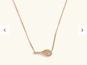 Fuchsia Hercules Side Swing Tennis Racket necklace featuring a detailed tennis racket pendant on a silver chain.