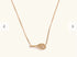 Fuchsia Hercules Side Swing Tennis Racket necklace featuring a detailed tennis racket pendant on a silver chain.