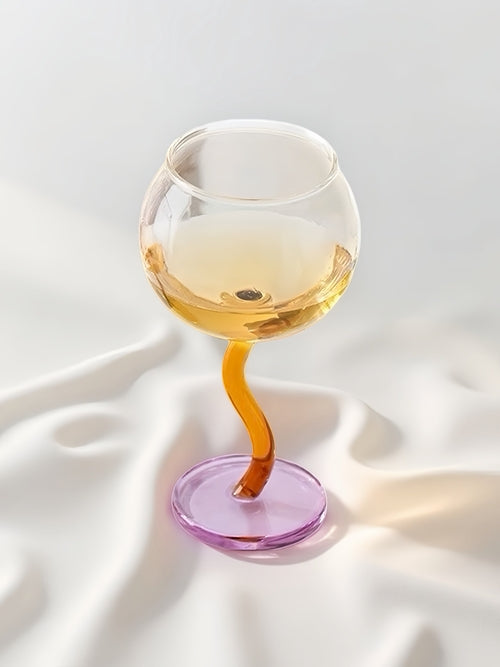 Handblown bubble wine glass with wavy stem, retro whimsical design, perfect for eclectic home decor, by Inspecial Home.