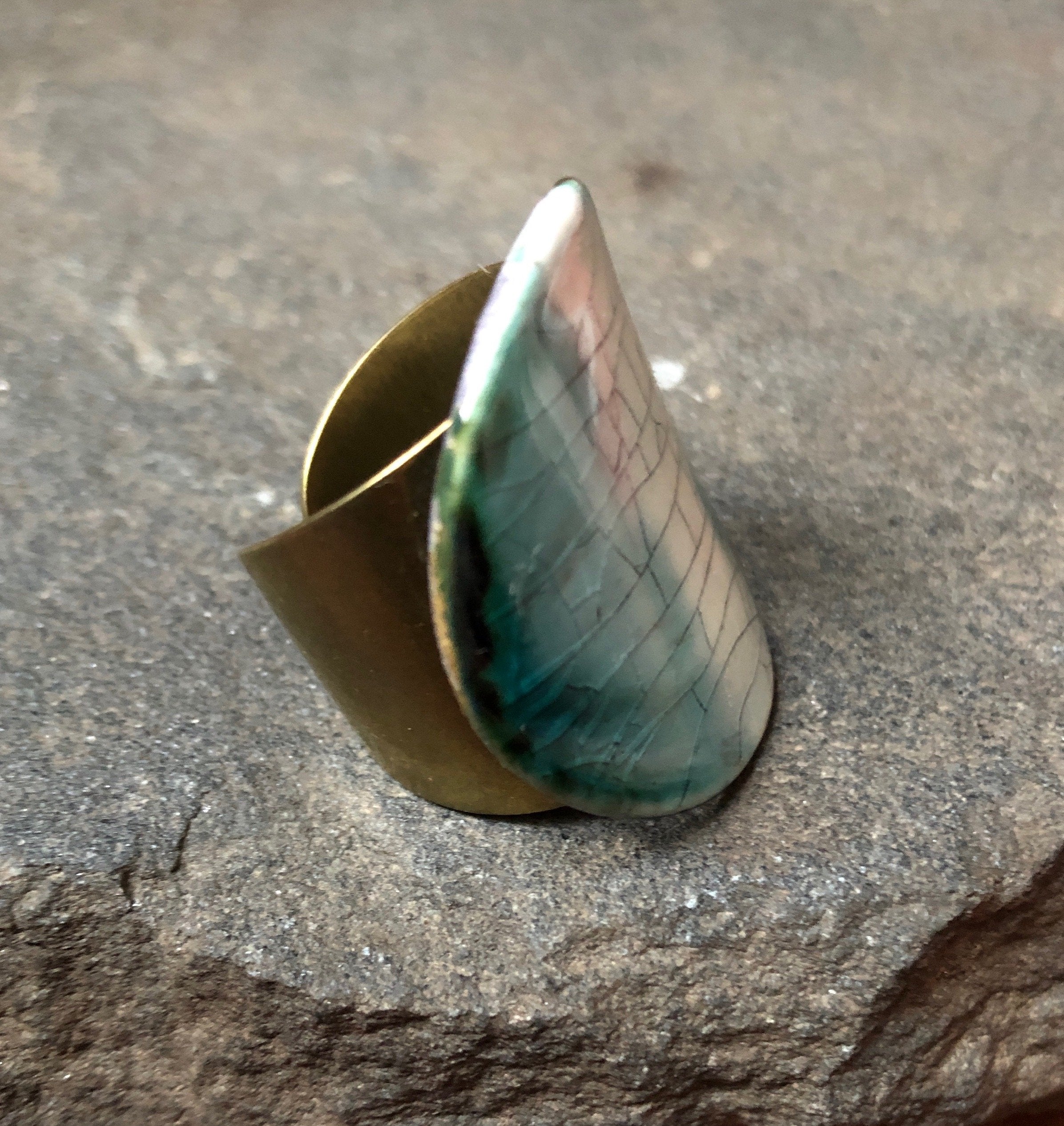 Adjustable handmade ceramic cocktail ring in teal color by Azure Nesoi, featuring a bold statement design.