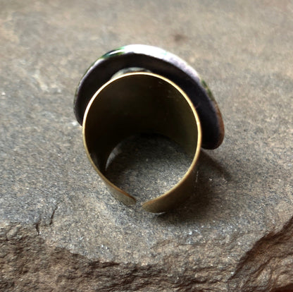 Adjustable handmade ceramic cocktail ring in teal by Azure Nesoi, featuring a bold statement design and unique craftsmanship.