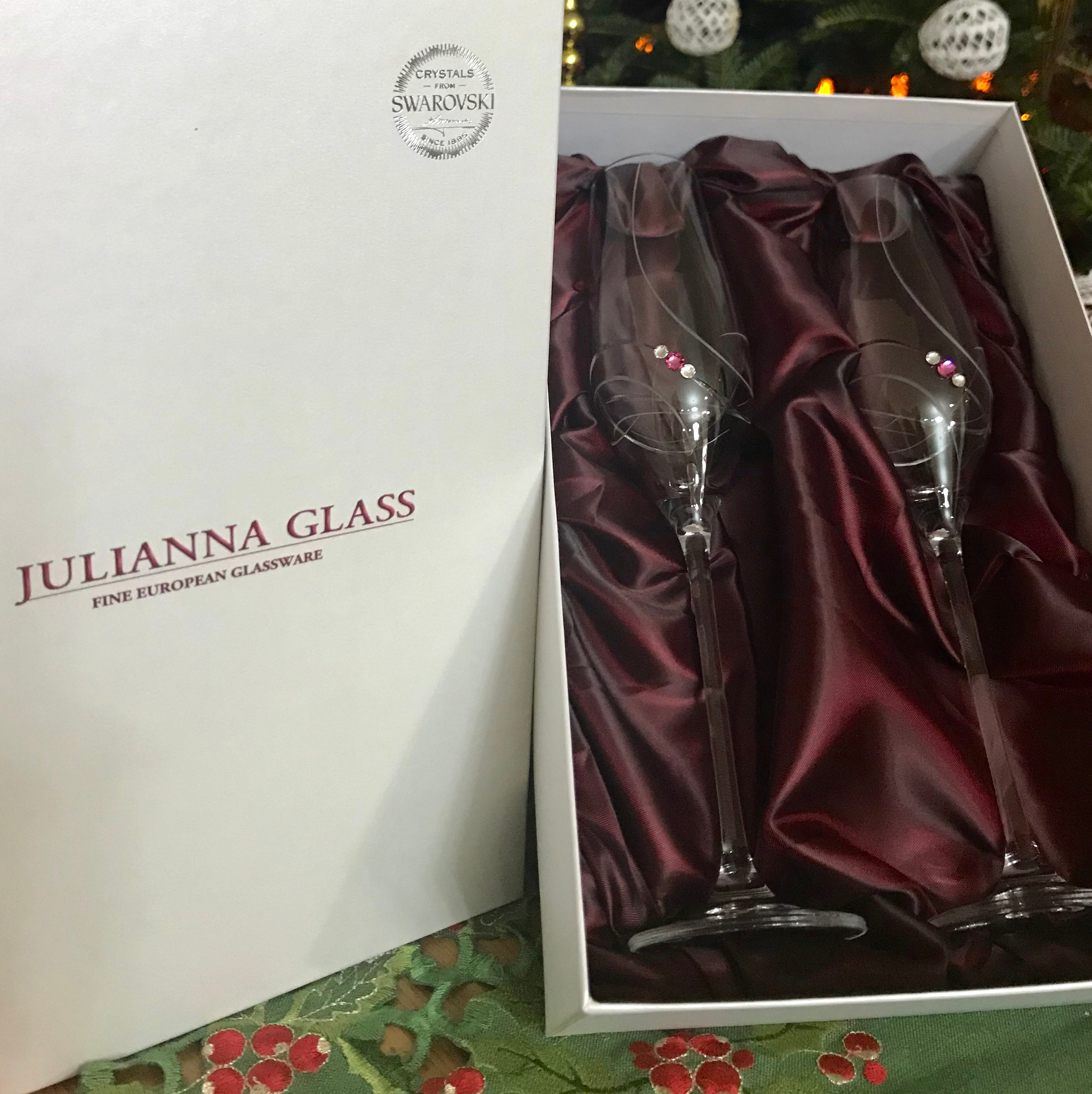 Set of two Crimson Shadow pink ribbon champagne glasses in a gift box, elegant drinkware for celebrations.