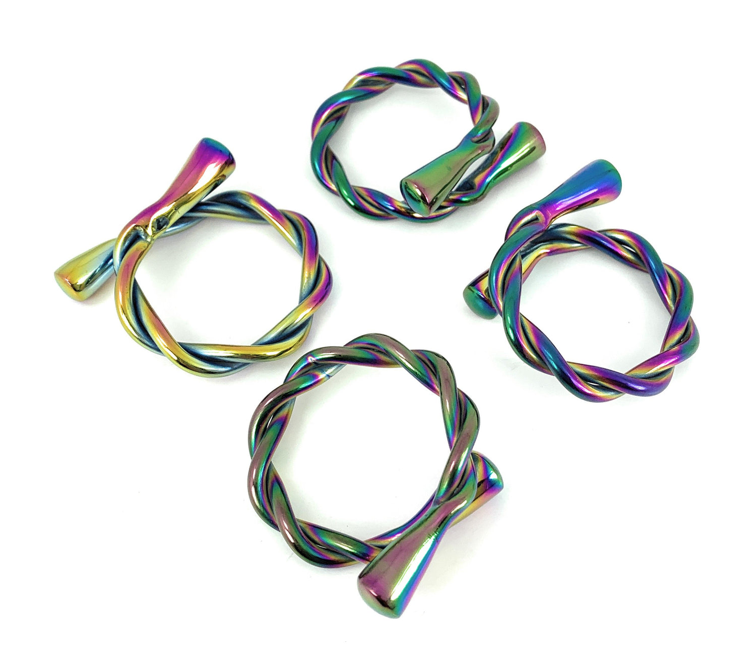 Set of four Vibhsa modern rainbow napkin rings by Gold Juniper, dishwasher safe, perfect for stylish home and table decor.