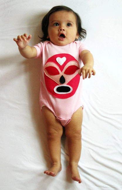 Pink Mexican wrestler baby onesie featuring a luchador Rosa design, by Sky Blue Milo, perfect for adorable baby clothing.