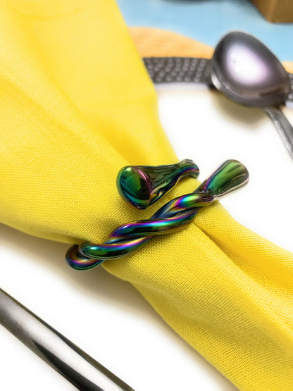 Set of four Vibhsa modern rainbow napkin rings by Gold Juniper, dishwasher safe, perfect for stylish table decor.
