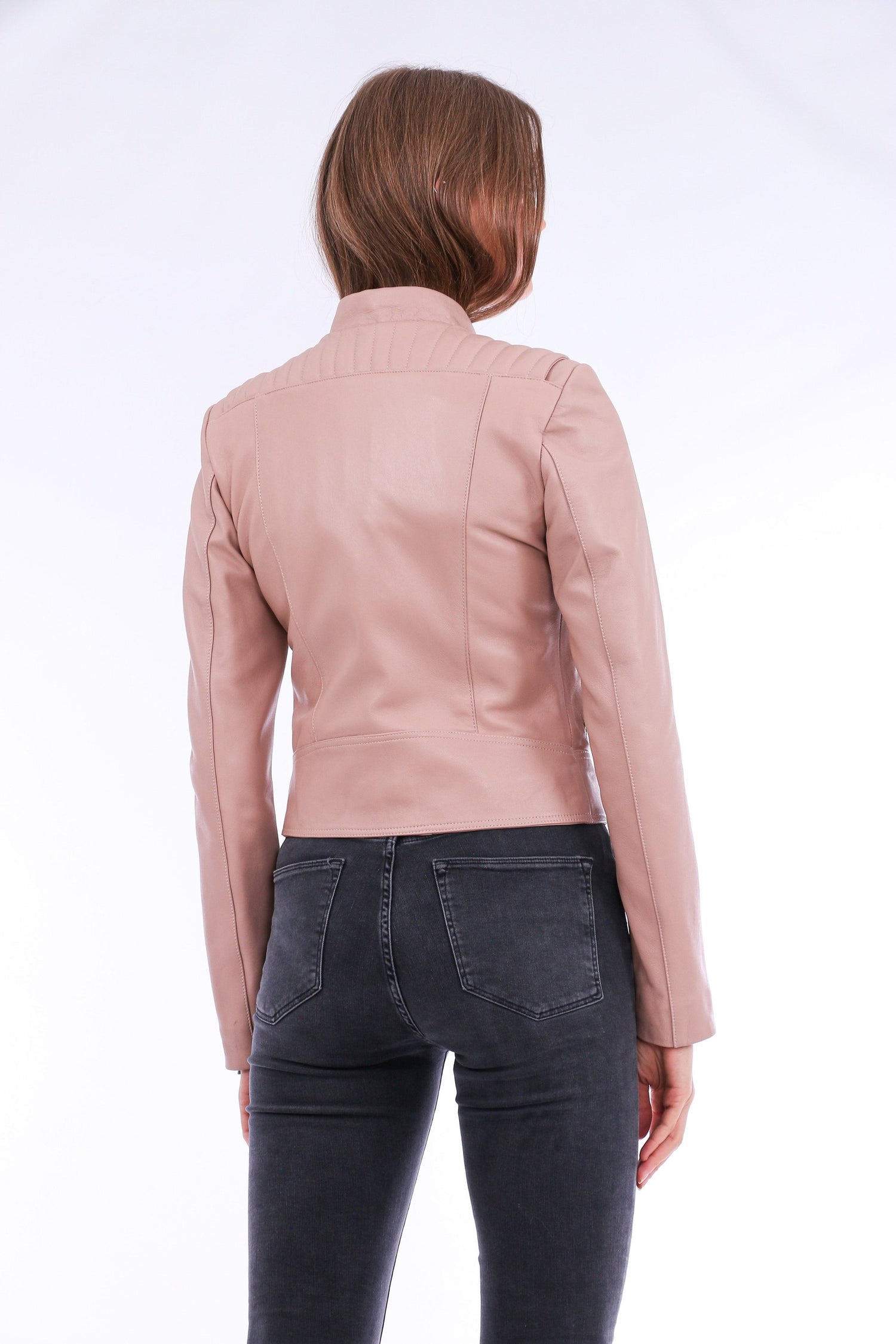 Pink Rovigo Leather Biker Jacket by Sangria Iapetus displayed on a hanger, showcasing its stylish design and high-quality leather.