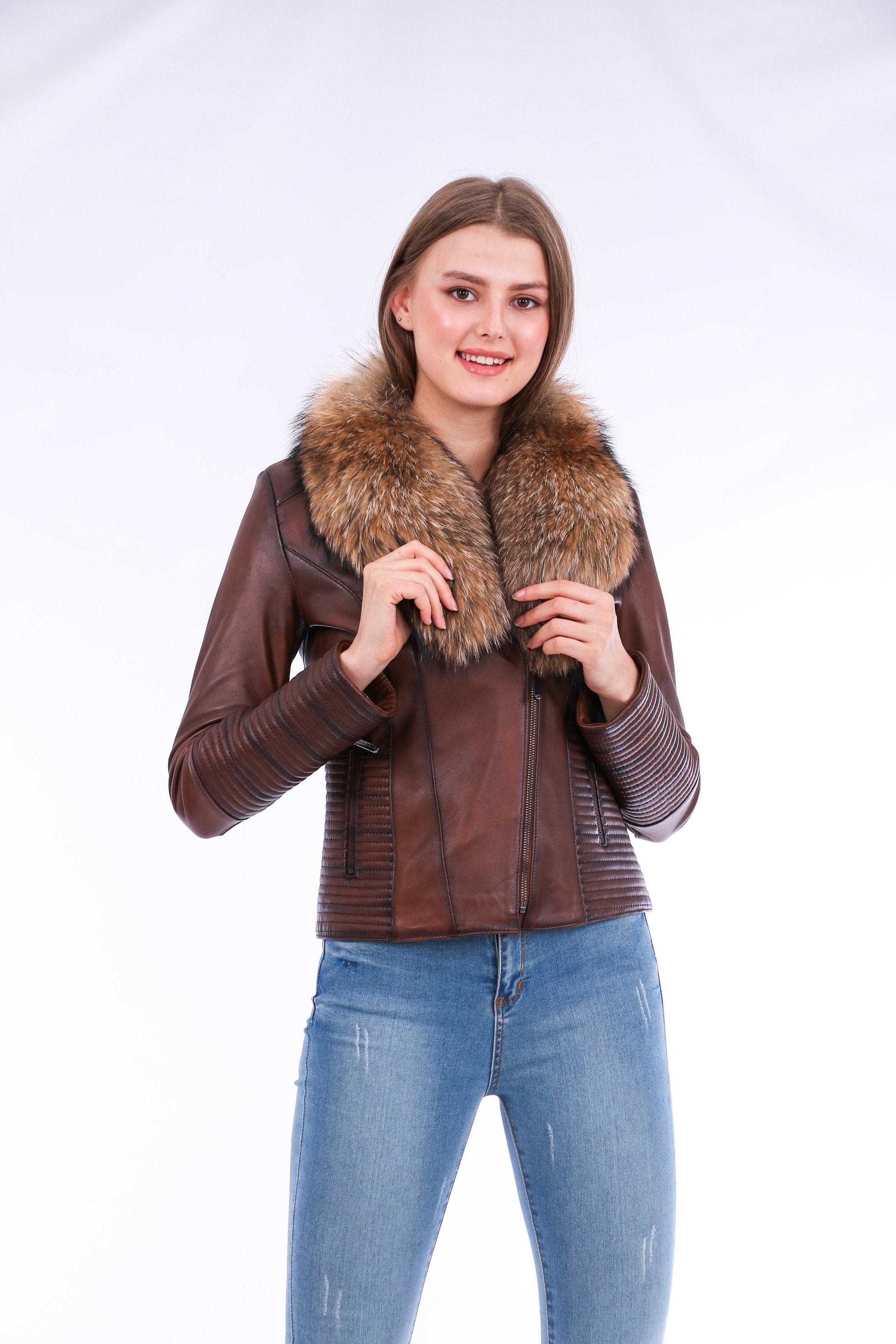 Brown Ravenna Leather Biker Jacket by Sangria Iapetus, featuring classic design and detailed stitching on a hanger.