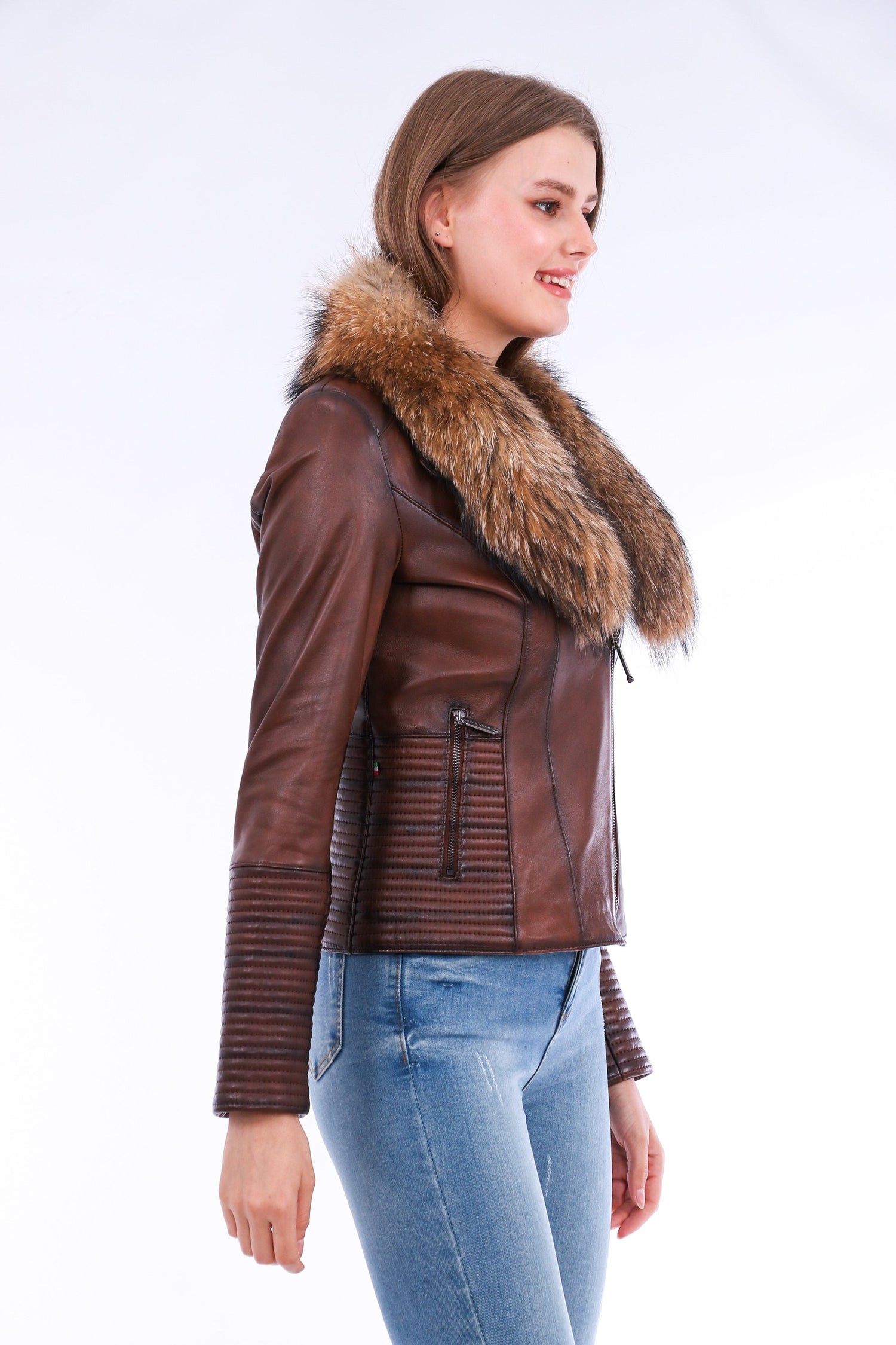 Brown Ravenna Leather Biker Jacket by Sangria Iapetus displayed on a hanger with visible zipper details and classic biker design.