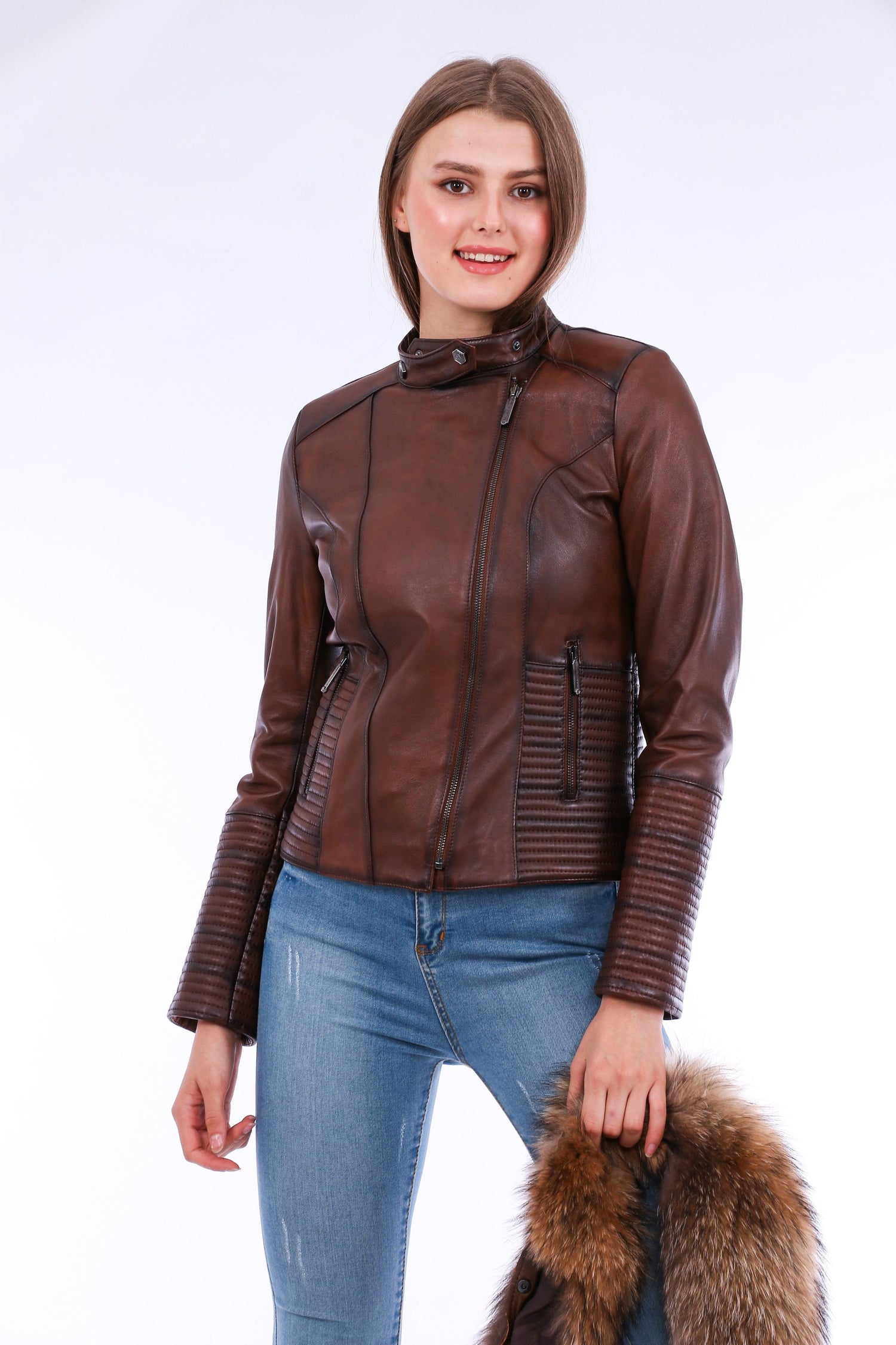 Brown Ravenna Leather Biker Jacket by Sangria Iapetus, featuring classic lapels and silver hardware, displayed on a hanger.