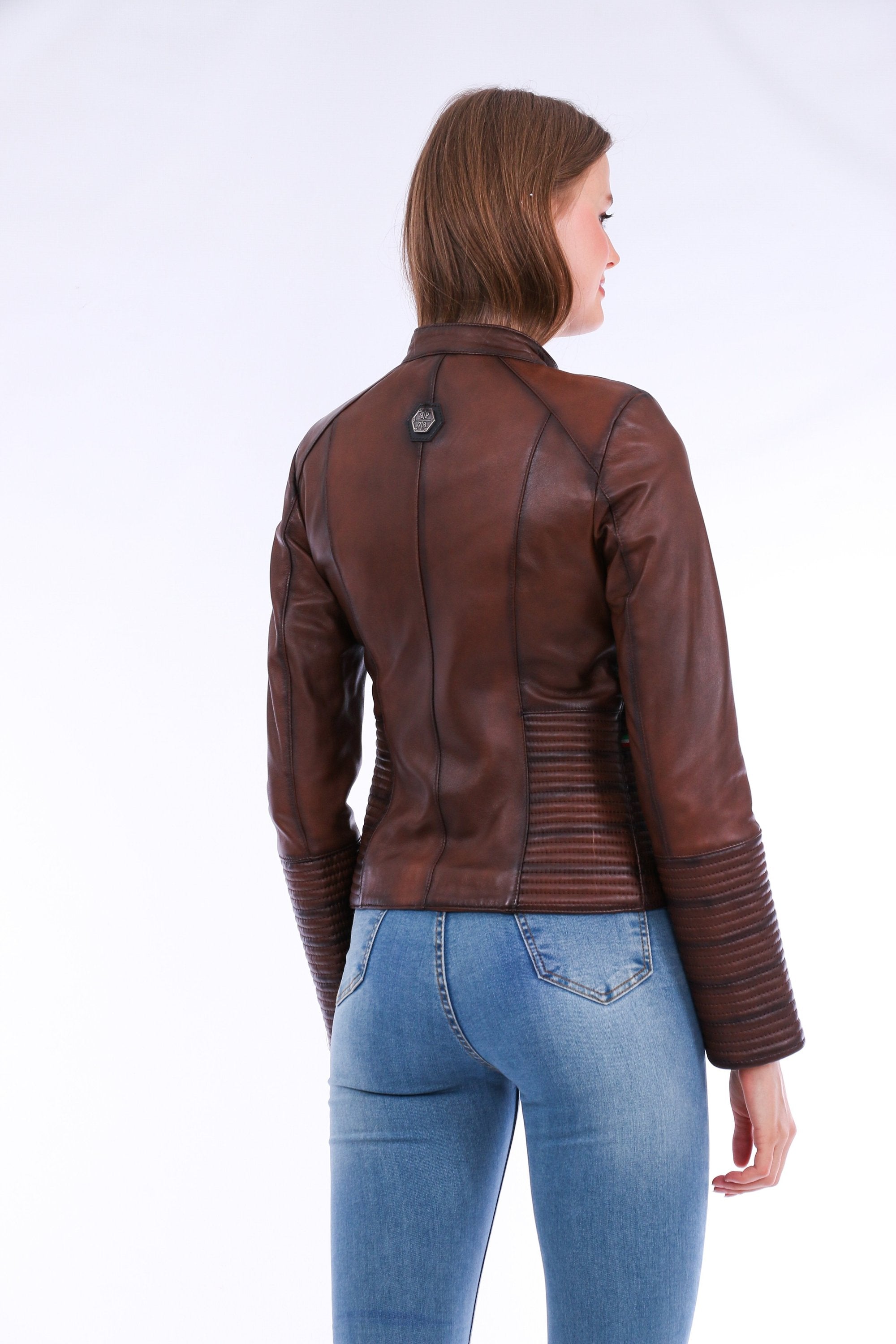 Brown Ravenna leather biker jacket by Sangria Iapetus, featuring classic lapels, silver hardware, and a fitted design.