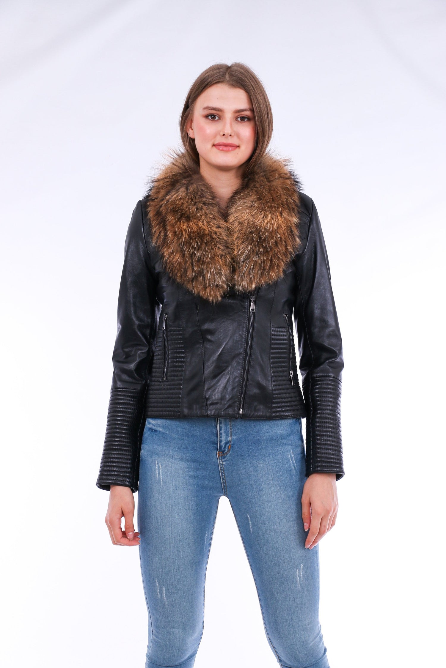 Black Ravenna leather biker jacket by Sangria Iapetus featuring classic lapels and silver hardware, displayed on a hanger.