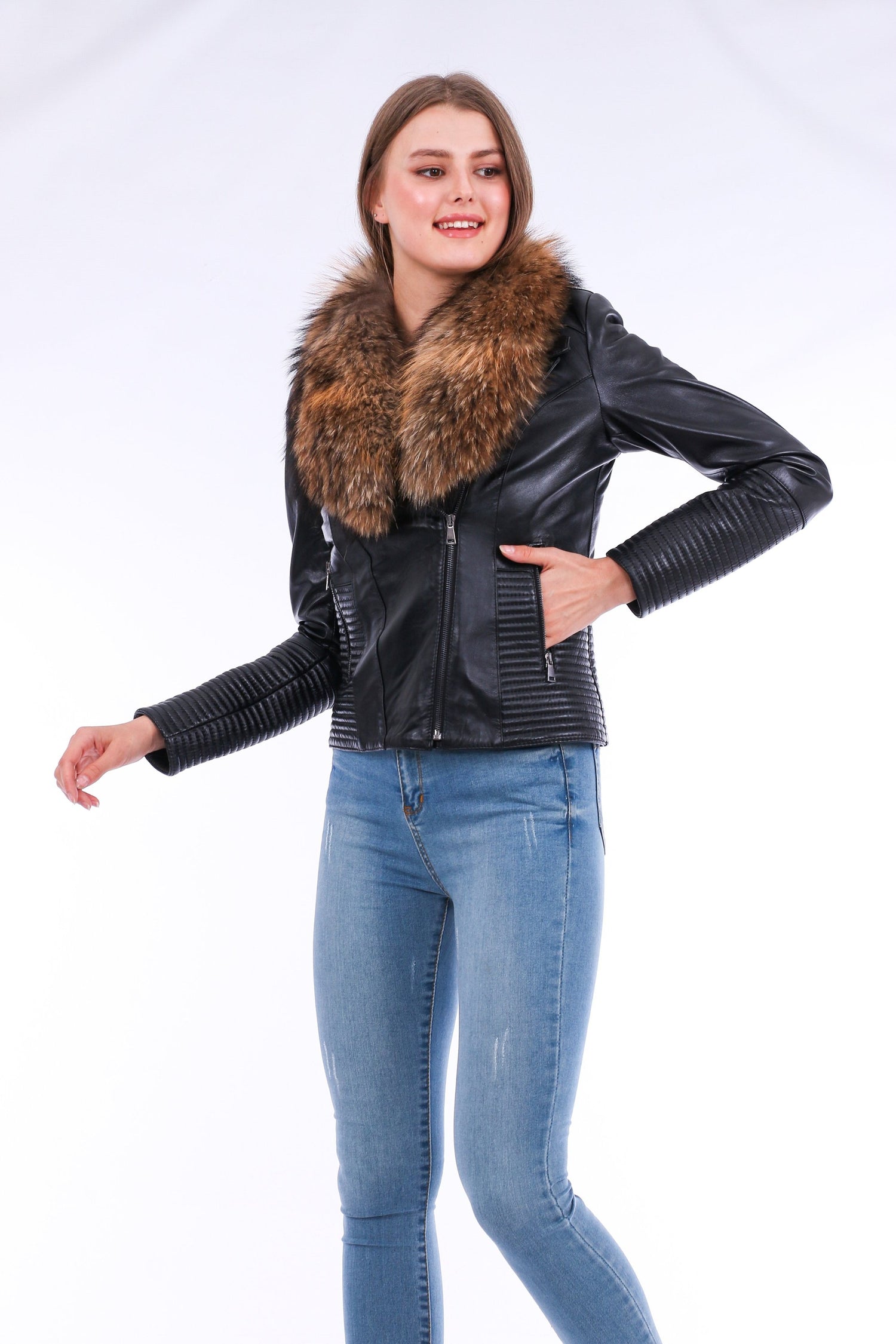 Black Ravenna leather biker jacket by Sangria Iapetus, featuring classic lapels and silver hardware, displayed on a hanger.