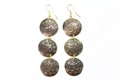 Silver Hestia three-tier Om earrings with lotus petal design, featuring layered silver earrings with intricate lotus motifs.