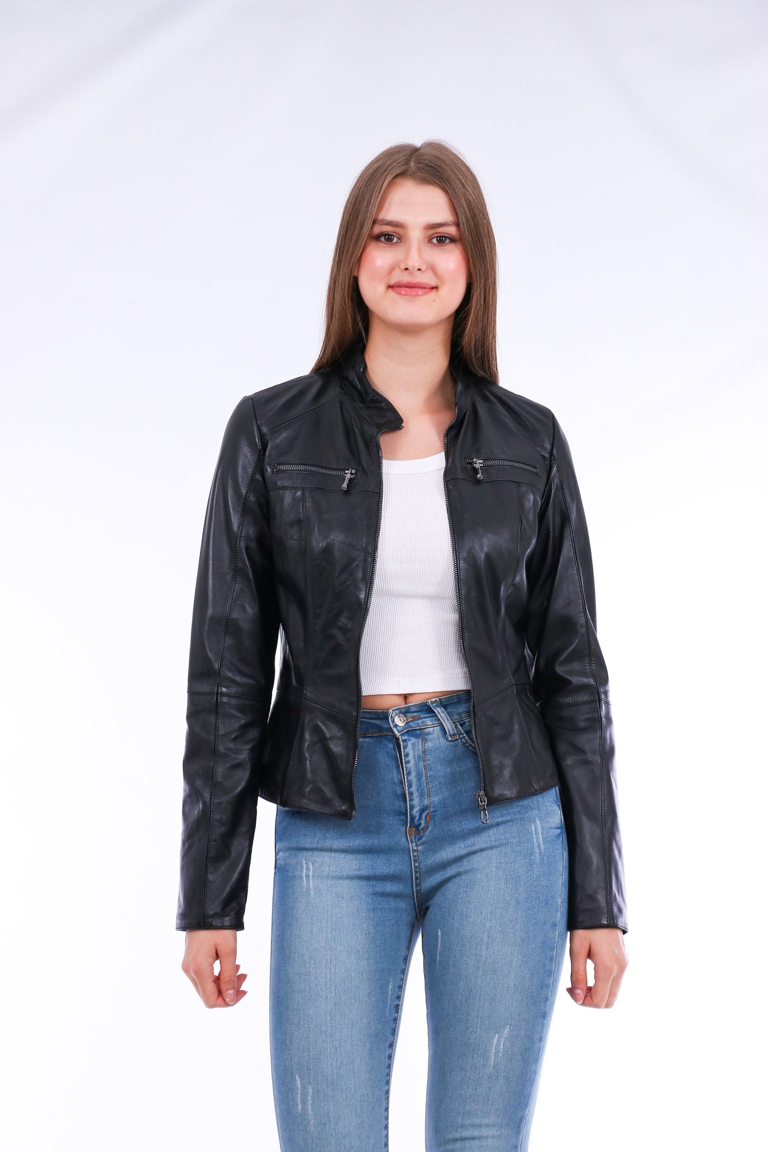 Black Venici leather biker jacket by Sangria Iapetus with silver zipper details and a fitted collar, displayed on a hanger.