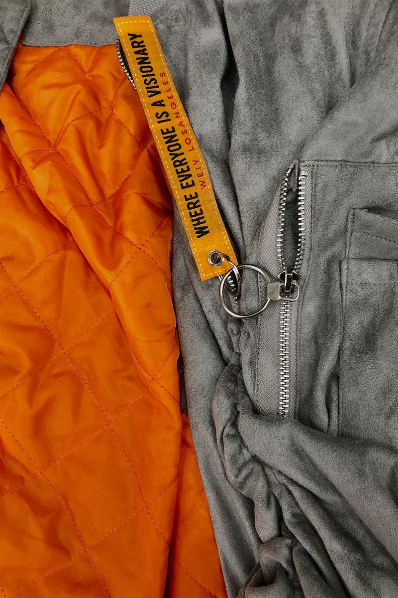 Grey smoke faux suede bomber jacket by Lime Milo, shown with a tagged front, casual style, and smooth textured fabric.