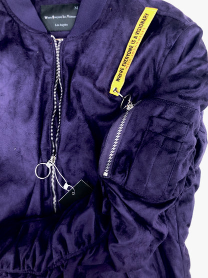 Lime Milo faux suede bomber activewear jacket in beige, shown on a hanger with a smooth texture and stylish design.