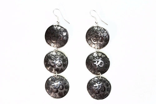 Silver Hestia three-tier om earrings with lotus petal design, featuring dangling silver earrings with intricate lotus motifs.