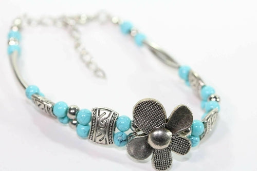 Silver Hestia petal-shaped bracelet with delicate silver flowers, perfect for elegant petal-inspired jewelry designs.