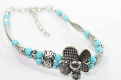 Silver Hestia petal-shaped bracelet with delicate silver flowers, perfect for elegant petal-inspired jewelry designs.