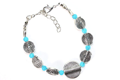 Silver Hestia Infinity Spiral Charm Bracelet featuring a twisted silver design and a delicate infinity charm.