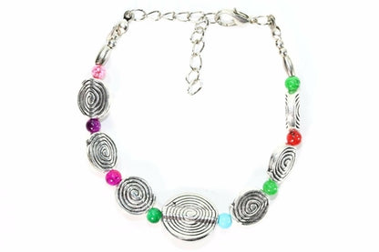 Silver Hestia infinity spiral charm bracelet with intertwined metal loops and delicate chain design.