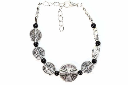 Silver Hestia Infinity Spiral Charm Bracelet featuring a sleek, silver design with an infinity spiral charm on a delicate chain.