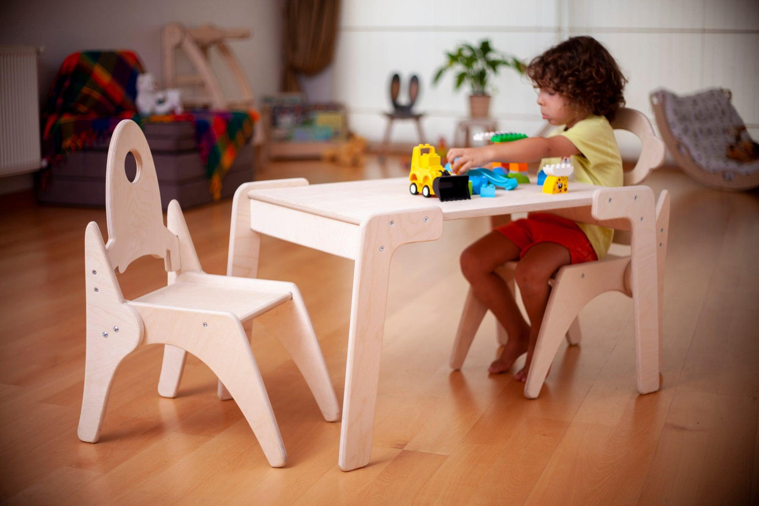Red Oceanus Montessori table and chair set shown in a bright, child-friendly classroom setting, ideal for early learning environments.