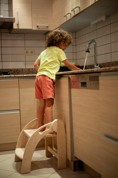 Red Oceanus foldable Montessori kitchen step stool with wooden steps and white frame, designed for children’s safe, easy access.