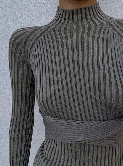 Azure Thanatos Malika Knit Dress shown on a model, featuring a fitted silhouette, long sleeves, and a textured knit fabric.