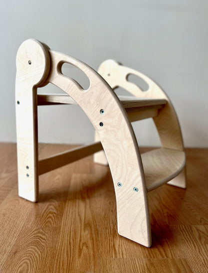 Red Oceanus foldable Montessori kitchen step stool with sturdy wooden construction and non-slip steps for safe elevation.
