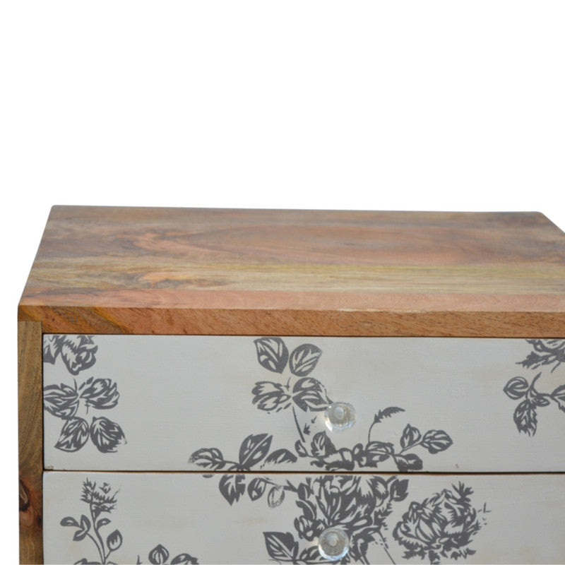 Black floral screen printed bedside table by Jade Epimetheus, showcasing intricate floral patterns and modern furniture design.