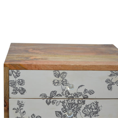 Black floral screen printed bedside table by Jade Epimetheus, showcasing intricate floral patterns and modern furniture design.