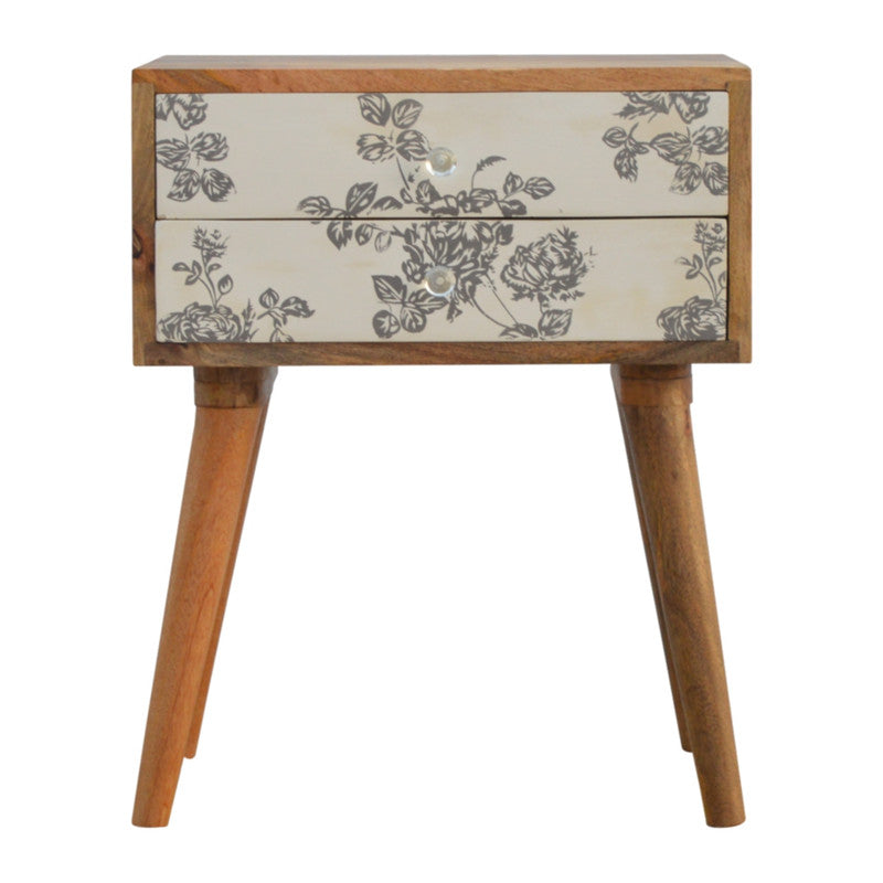 Black floral screen printed bedside table by Jade Epimetheus, showcasing intricate floral designs and modern furniture style.
