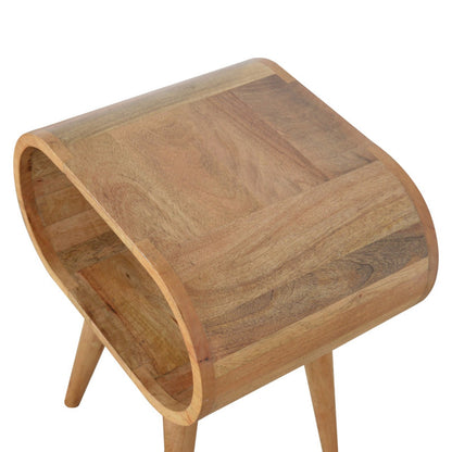 Circular open bedside table by Jade Epimetheus featuring a modern design with a round top and open shelving.