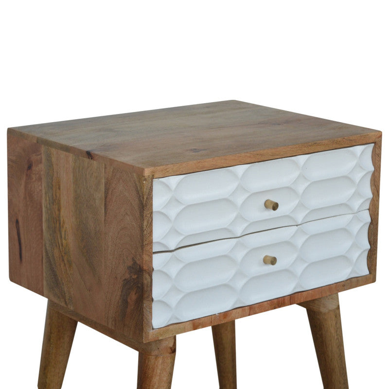 Carved bedside table from Jade Epimetheus Capsule Carved Furniture collection, featuring intricate woodwork and a natural finish.