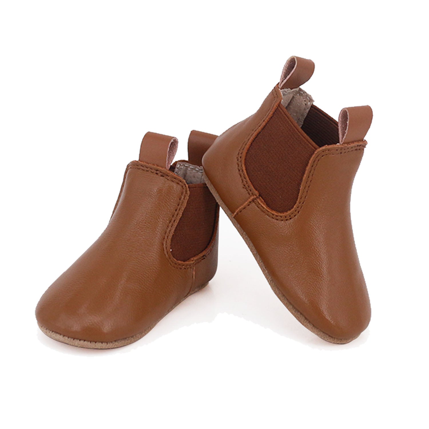 Tan riding style baby and toddler first walker boots by Rose Chestnut, featuring soft leather and sturdy soles.