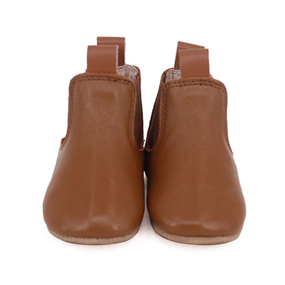 Tan riding-style baby and toddler first walker boots by Rose Chestnut, featuring soft leather and buckle accents.