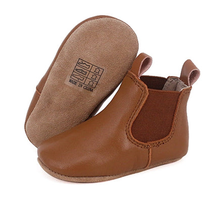 Tan riding-style baby and toddler first walker boots with soft sole from Rose Chestnut, featuring classic design and comfortable fit.
