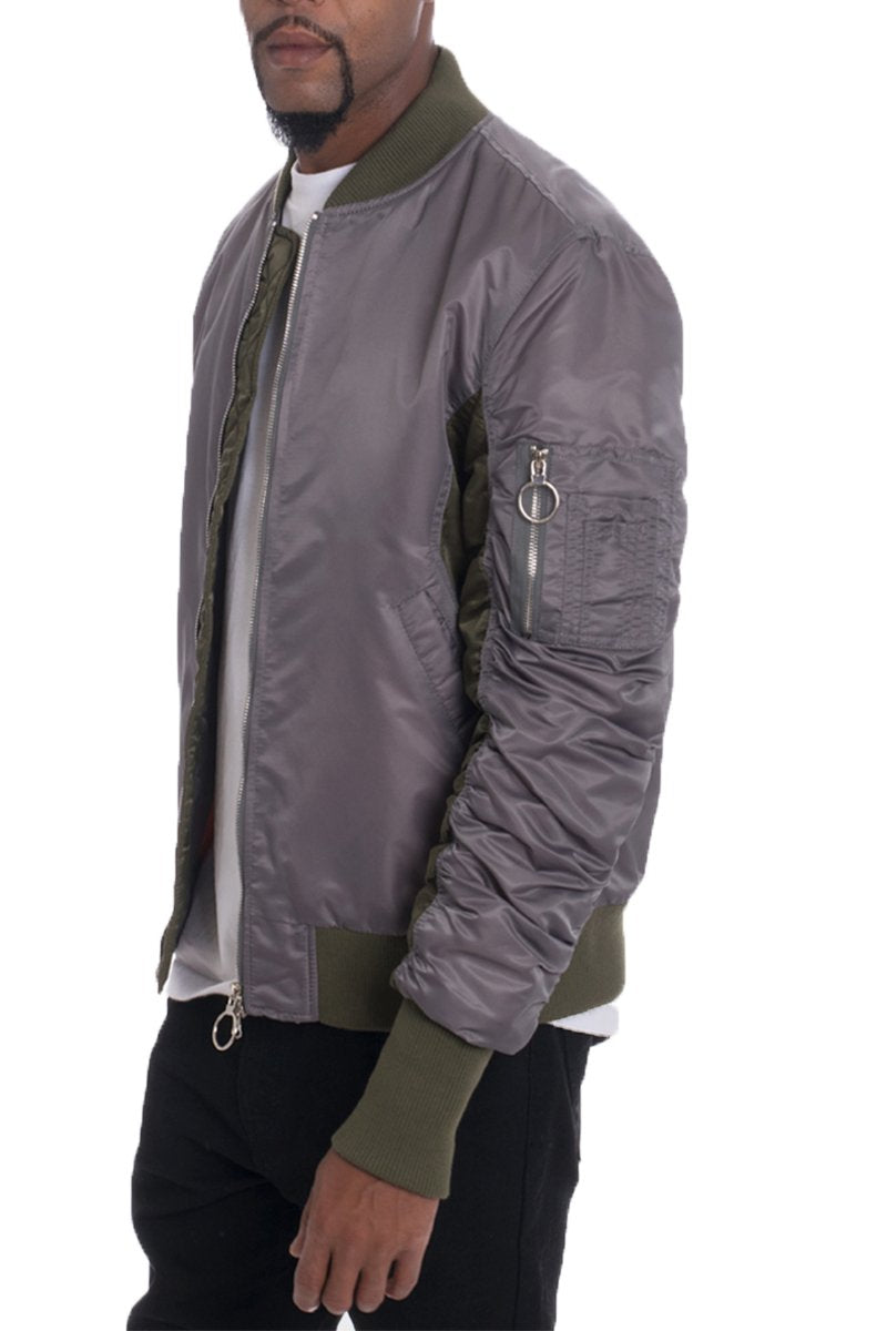 Grey two-tone bomber jacket by Lime Milo, stylish outerwear with modern design, shown on a model.