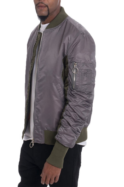 Grey two-tone bomber jacket by Lime Milo, stylish outerwear with modern design, shown on a model.