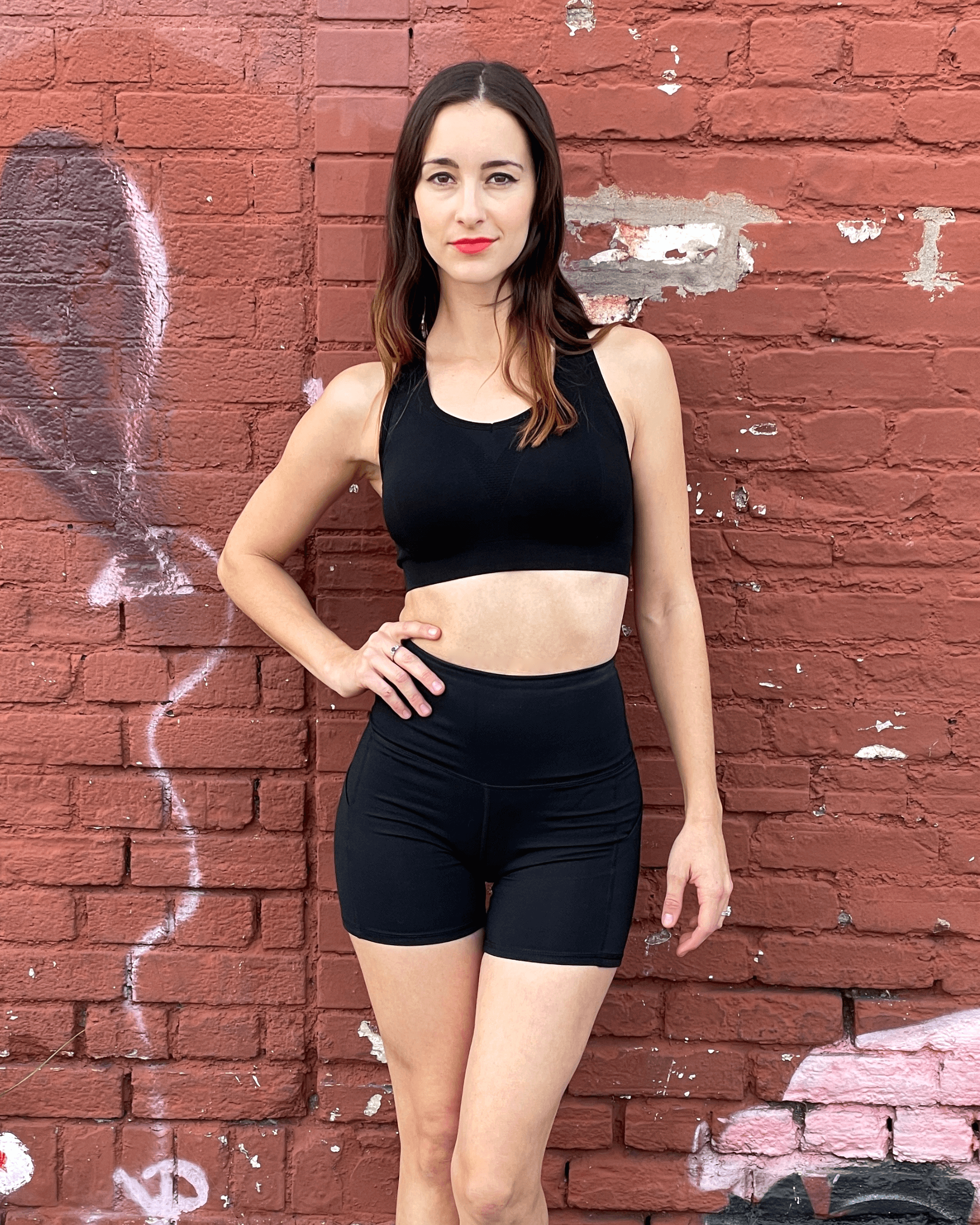 Black Lavender Jolie high-waisted athletic shorts with hip pockets, shown in black, designed for activewear and comfortable movement.
