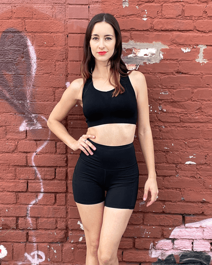 Black Lavender Jolie high-waisted athletic shorts with hip pockets, shown in black, designed for activewear and comfortable movement.
