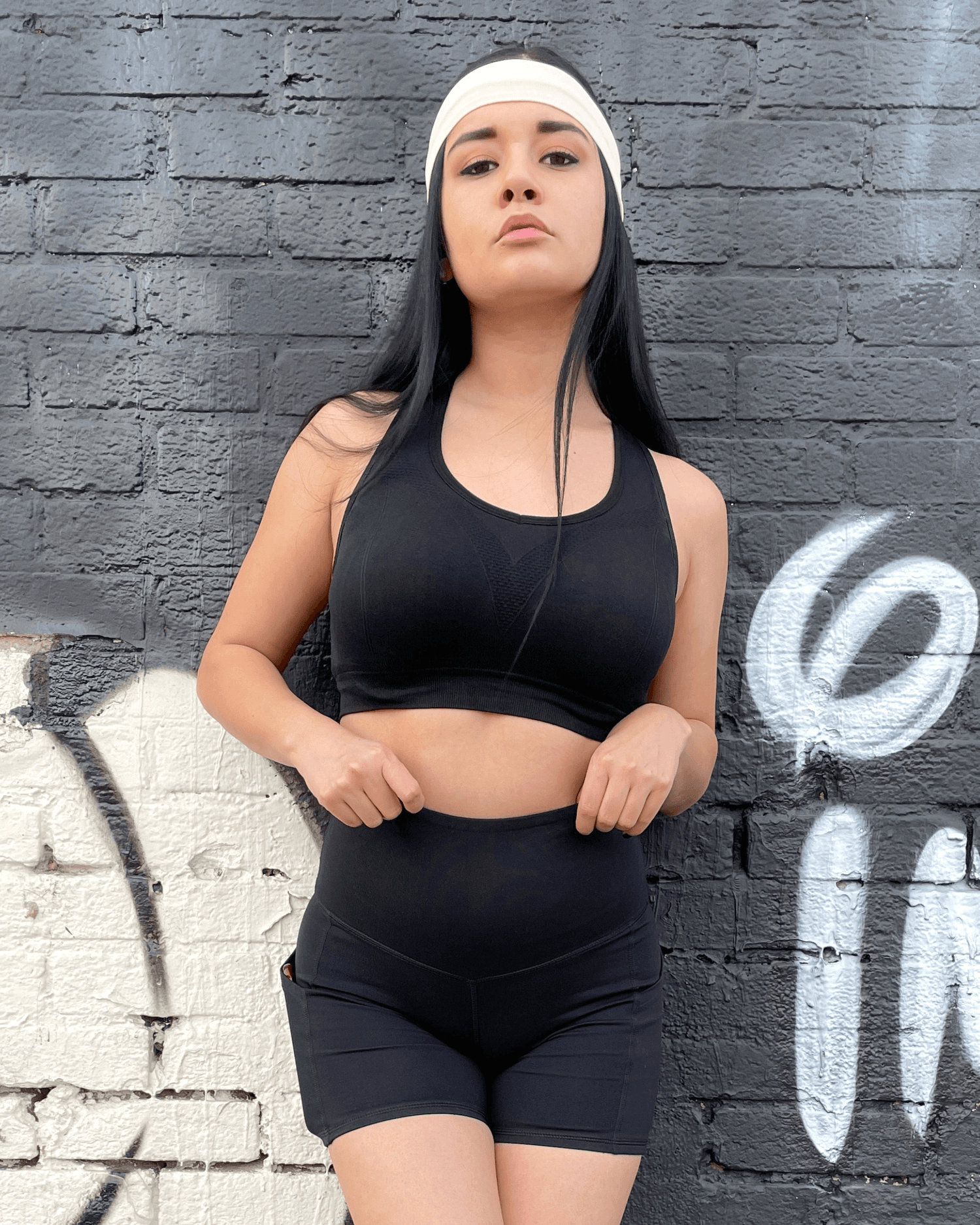 Black Lavender Jolie high-waisted athletic shorts with hip pockets, shown in black, designed for activewear and workout comfort.