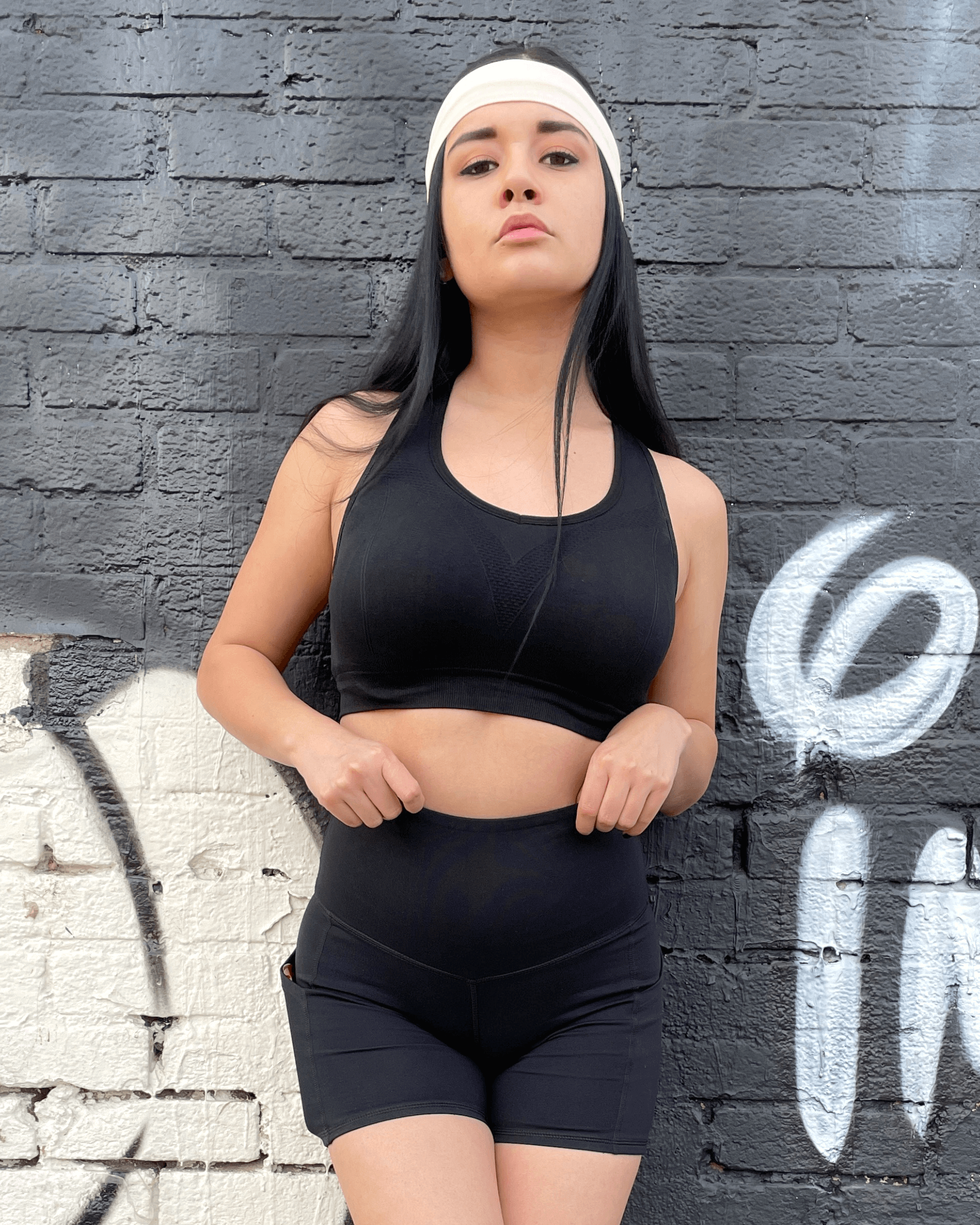 Black Lavender Jolie high-waisted athletic shorts with hip pockets, shown in black, designed for activewear and workout comfort.